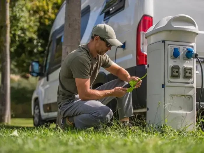 Man repairing the electrical pedestal at an RV Park - RVParkTV.com by Its All About Satellites