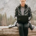Woman with Laptop Camping